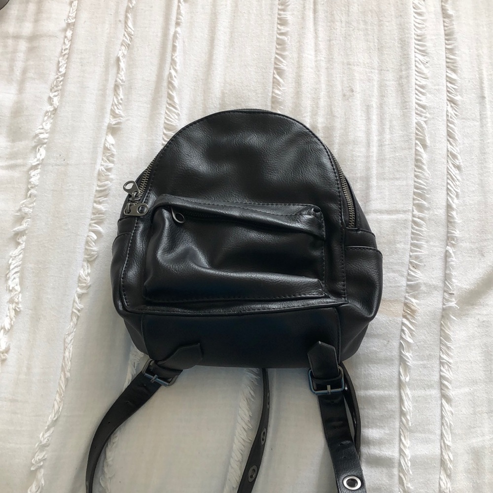 Small black book bag.